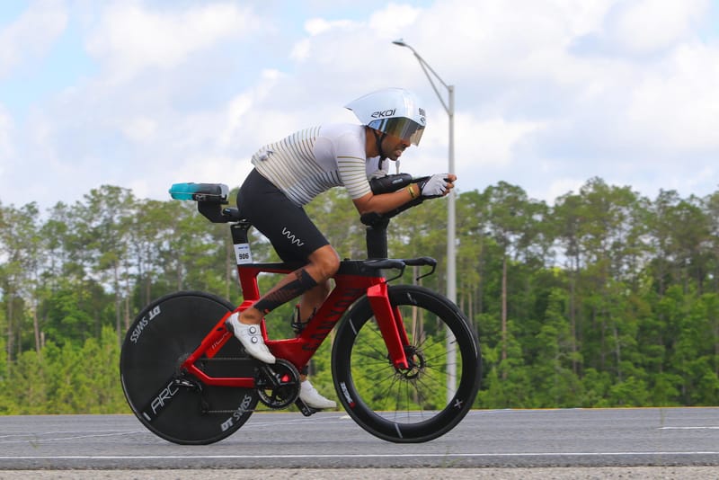 Mishu Biswas in the aero position on his time-trial bike at IRONMAN Jacksonville 2026