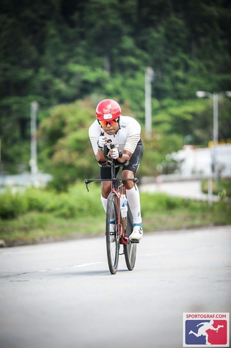 Mishu Biswas riding in the aero position during an IRONMAN bike leg